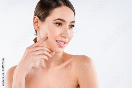 Cheerful half naked lady touching her clear skin isolated over white background