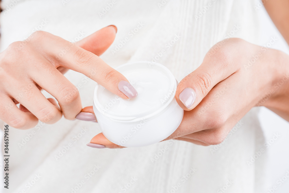 Close up shot of woman with body cream Close up shot of woman with body cream