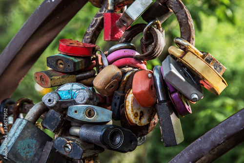  colored metal locks on a green background
