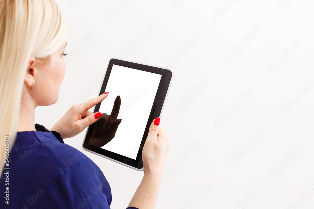 Business woman holding blank touch screen device. Business woman holding blank touch screen device.