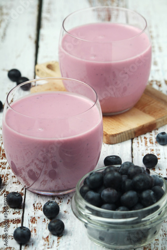 Two glasses with blueberry yogurt