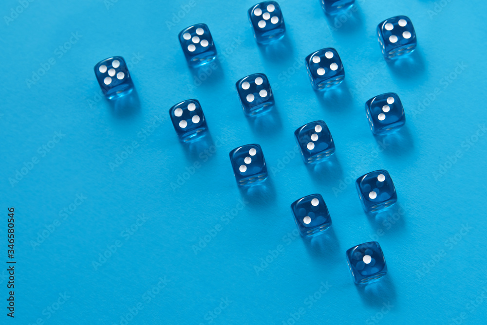 Rows of dice on blue background, triangle Rows of dice on blue background, triangle
