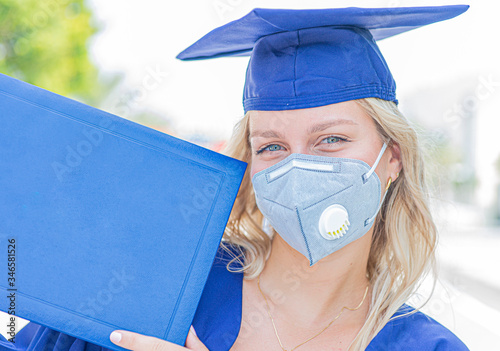 female graduate with a diploma,Covid