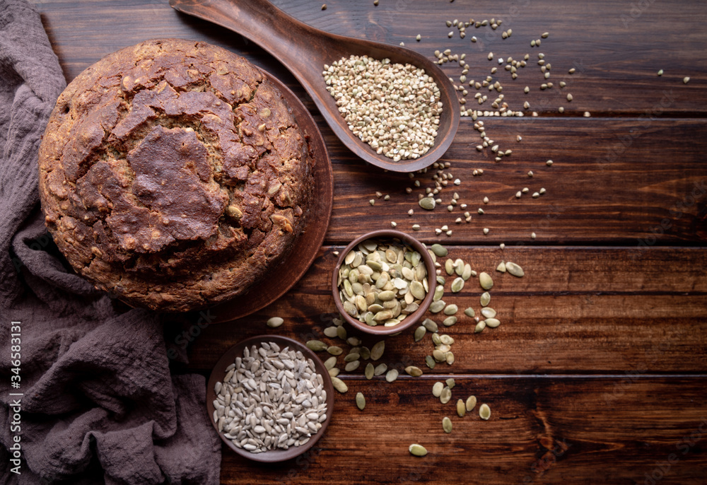 Homemade loaf of buckwheat bread top view on wooden background Homemade loaf of buckwheat bread top view on wooden background