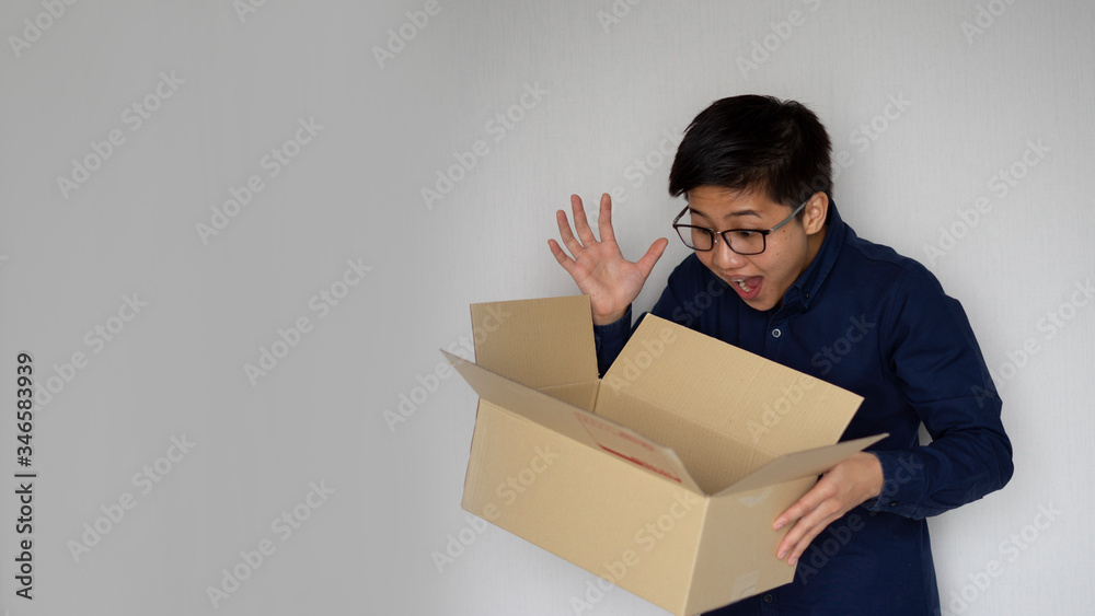 Delivery man employee wearing face mask gloves holding package paper box and opening. Service quarantine pandemic coronavirus virus 2019-ncov concept
Delivery man employee wearing face mask gloves holding package paper box and opening. Service quarantine pandemic coronavirus virus 2019-ncov concept