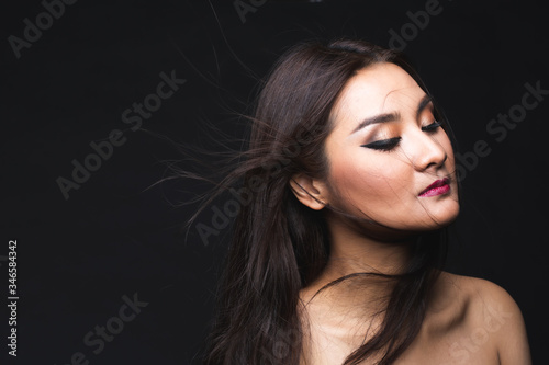 Portrait of young asian woman with makeup long hair.