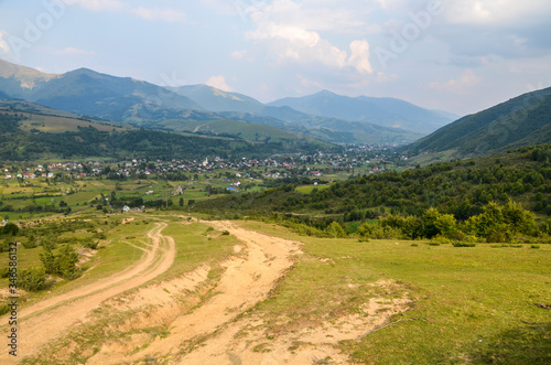 Beautiful nature landscape of mountain range Rural village in the valley from a distance. Natural background.