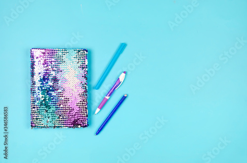 School supplies on blue background. Education concept. photo