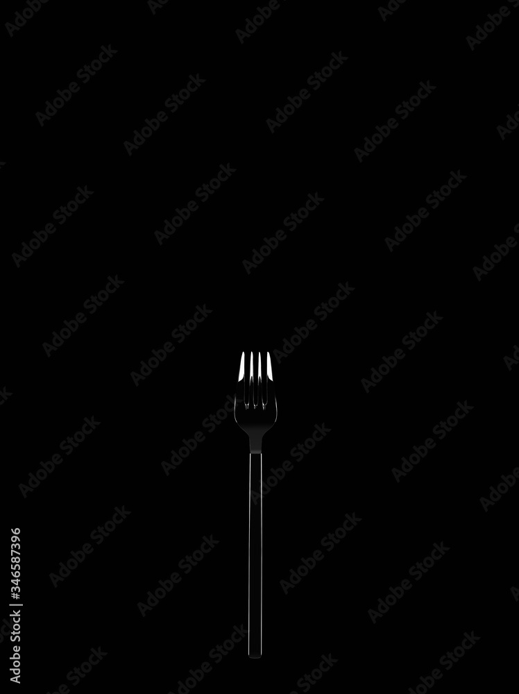 Stainless fork on black background with copy space. Stainless fork on black background with copy space.
