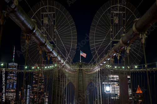 Brooklyn bridge during nighttime american flag