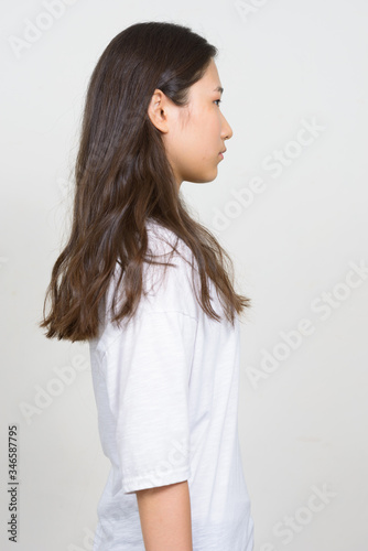 Profile view of young beautiful Asian woman