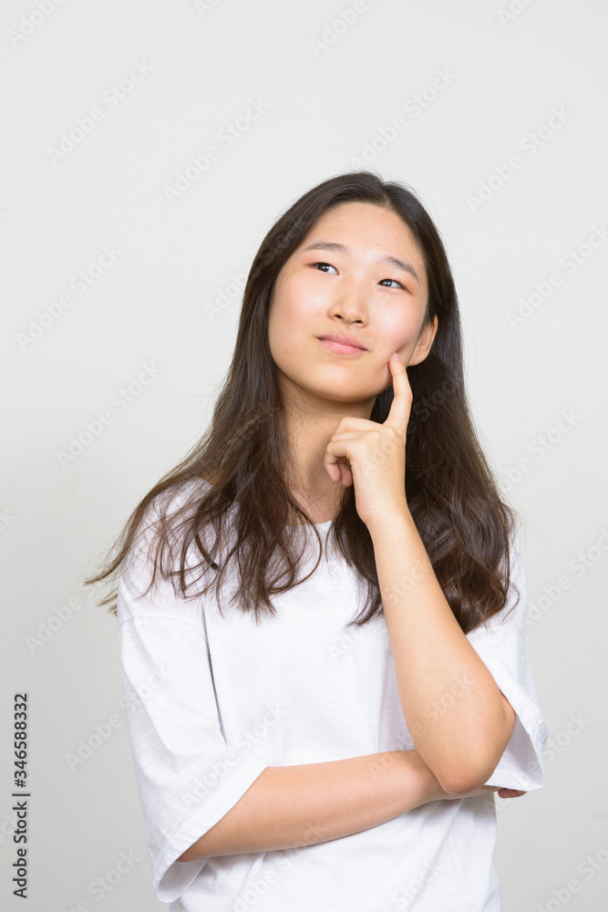 Portrait of young beautiful Asian woman thinking Portrait of young beautiful Asian woman thinking