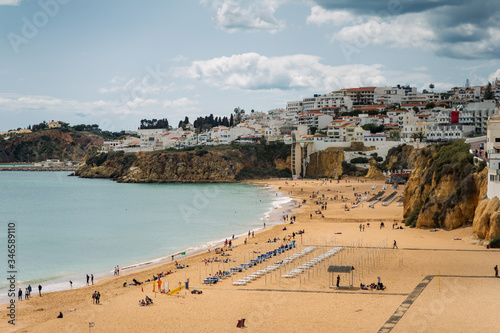 Beautiful city of Albufeira in southern portugal with city on the cliffs and touristic beach in summer © tavi004