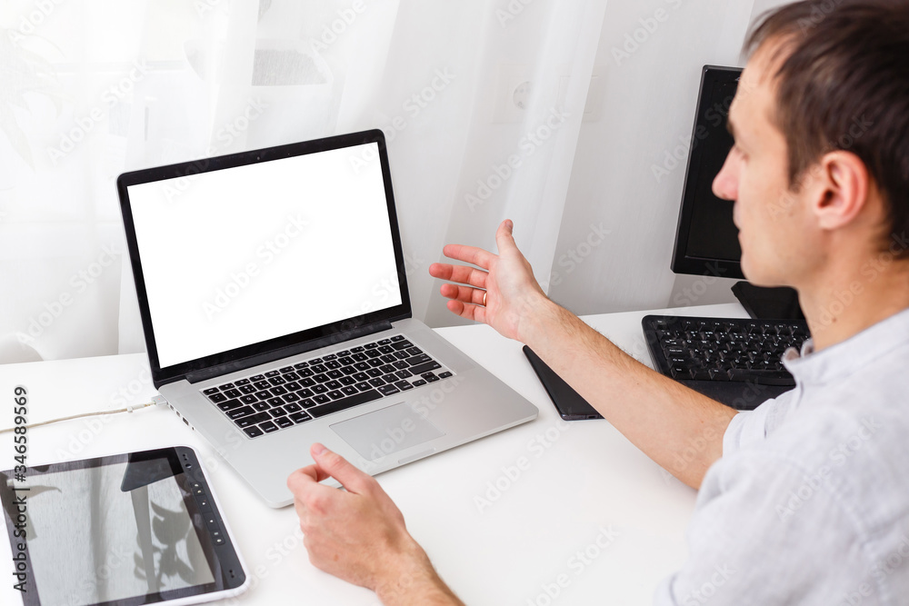 Back view of male person sitting front open laptop computer with blank empty screen for your information or content, modern businessman working in internet via notebook,student at coffee shop learning Back view of male person sitting front open laptop computer with blank empty screen for your information or content, modern businessman working in internet via notebook,student at coffee shop learning