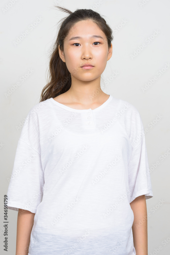 Portrait of young beautiful Asian woman with hair tied Portrait of young beautiful Asian woman with hair tied