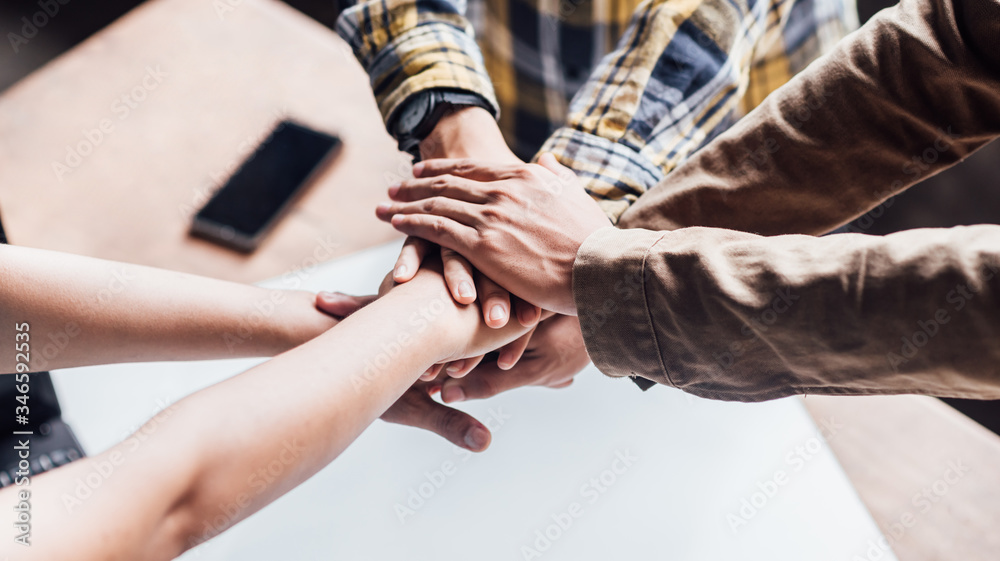 Business people making shaking hands together joining concept during a meeting Handshake in the office for finishing cooperation. Business people making shaking hands together joining concept during a meeting Handshake in the office for finishing cooperation.
