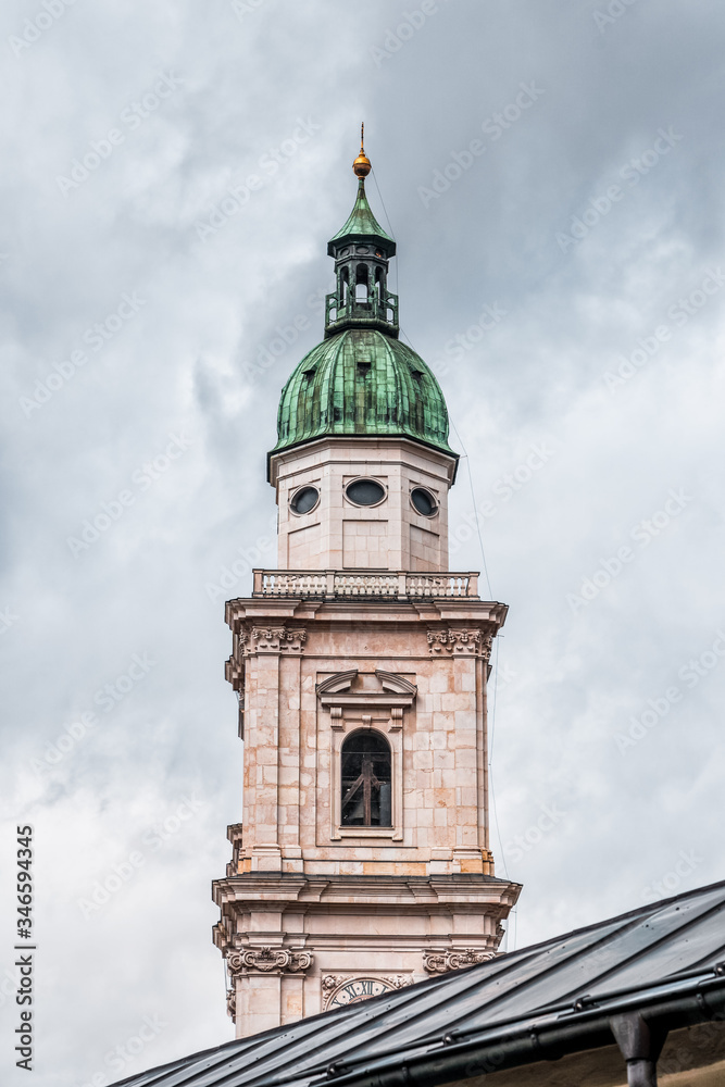 Steeple with onion dome of St. Peter Abbey in old town of Salzburg, Austria