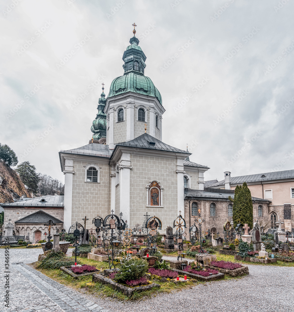 Fototapeta premium St Mary's Chapel with onion dome and cemetery ground in front inside St Peter Abbey in Salzburg