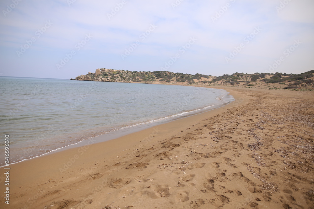 Desert landscape of Northern Cyprus Kyrenia coastline with stones and sand Alagadi turtle beach.