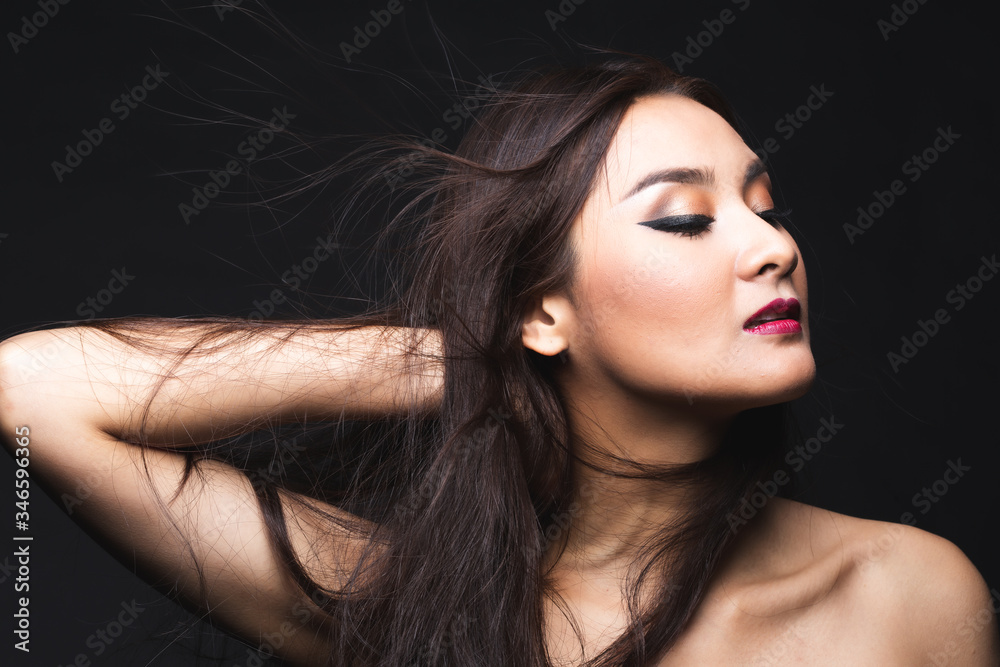 Portrait of young asian woman with makeup long hair.