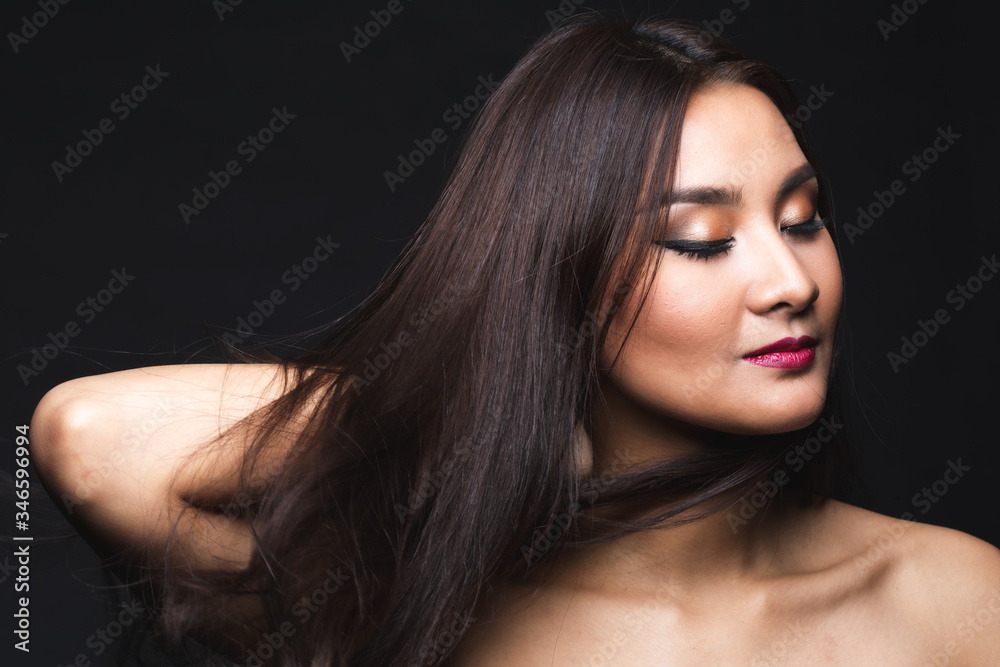 Fototapeta premium Portrait of young asian woman with makeup long hair.