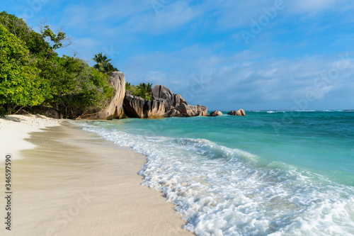 Anse Source d'Argent at La Digue Island, Seychelles. Heavenly beach with dazzling white sands, crystal clear waters, surrounded by beautiful granite boulders and coconut palms.