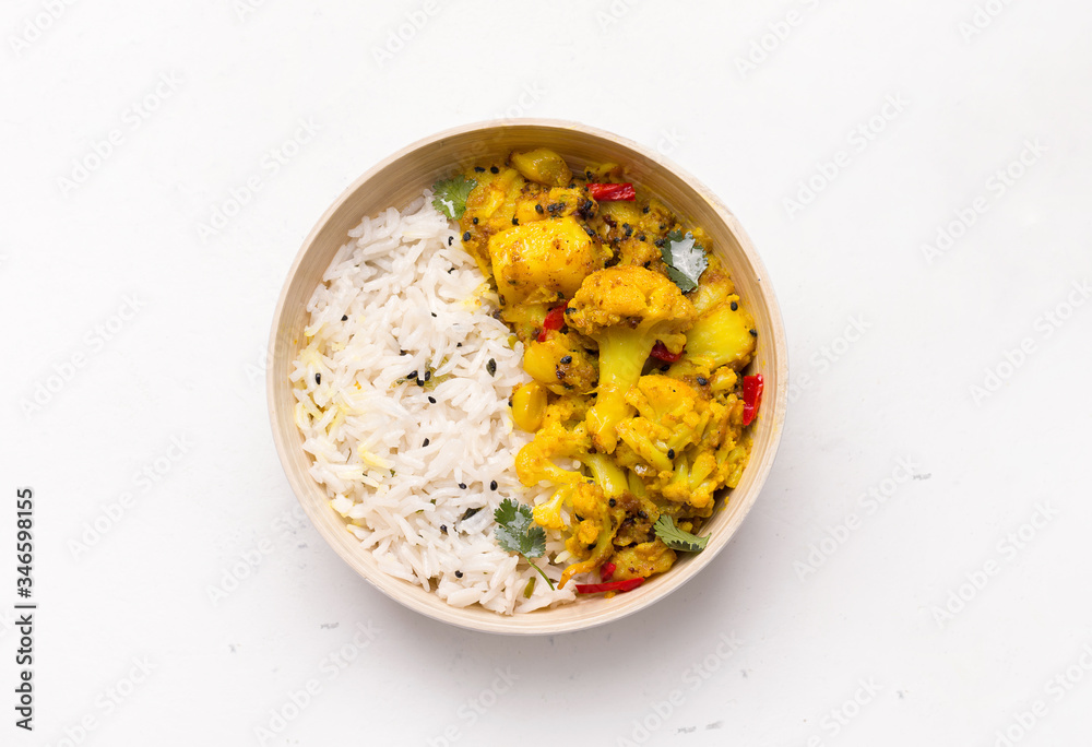 Aloo gobi indian vegetarian vegetable dish isolated on white background Aloo gobi indian vegetarian vegetable dish isolated on white background