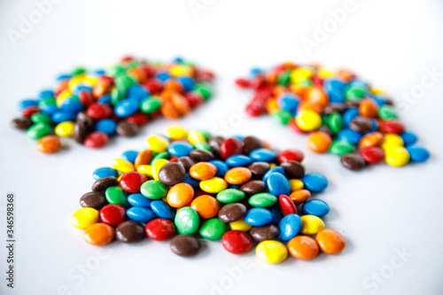Three piles of colored smarties