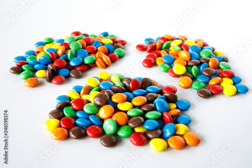 Three piles of colored smarties