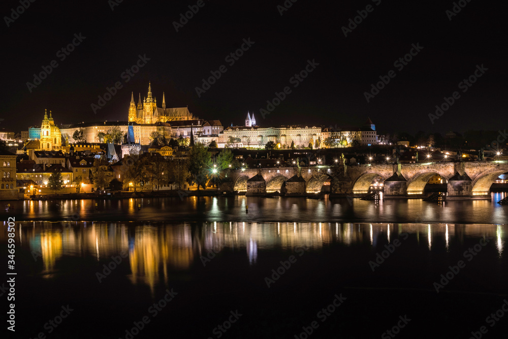 Czech Republic. Cityscape of Prague at night with view of Charles Bridge and Prague Castle.