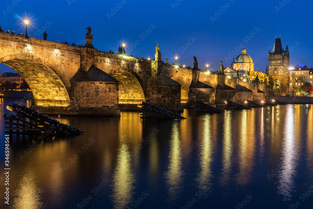 View of Charles Bridge in Prague, Czech Republic at sunset (blue hour). Charles Bridge is one of the most visited places in Prague. 