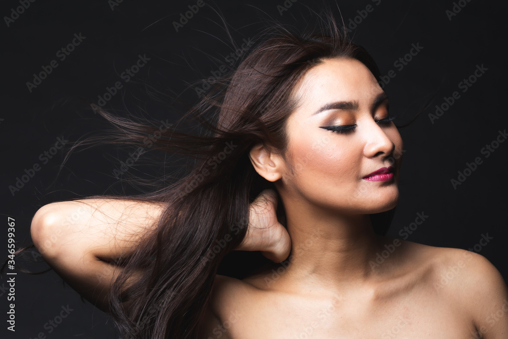 Fototapeta premium Portrait of young asian woman with makeup long hair.