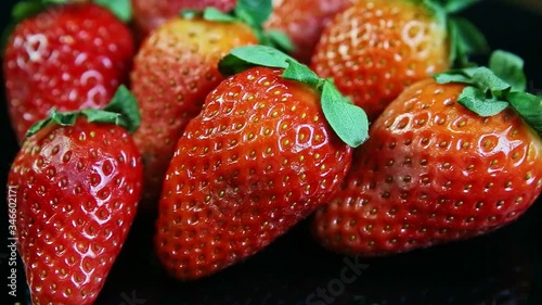 Wallpaper Mural macro view on group of whole ripe fresh juicy red strawberries served on black Torontodigital.ca