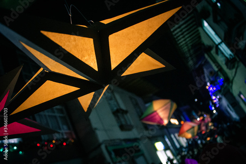 star-shaped street lamps and holiday lights