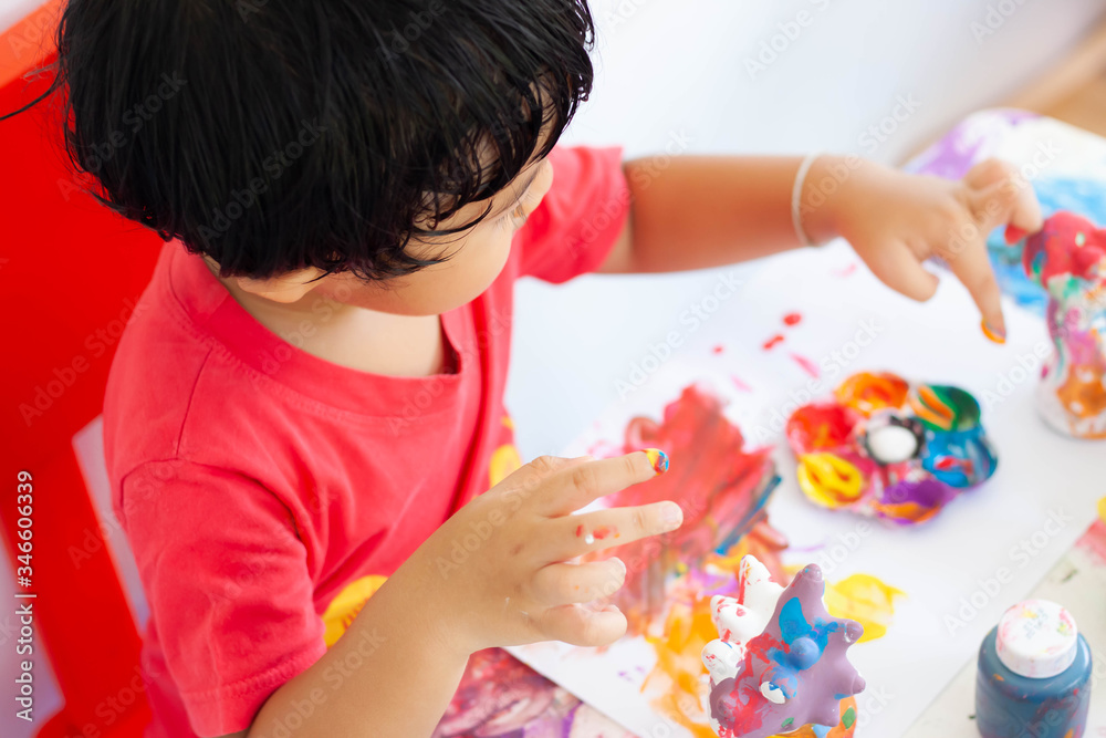 Children playing with watercolor stay at home. little boy and water colors. Children playing with watercolor stay at home. little boy and water colors.