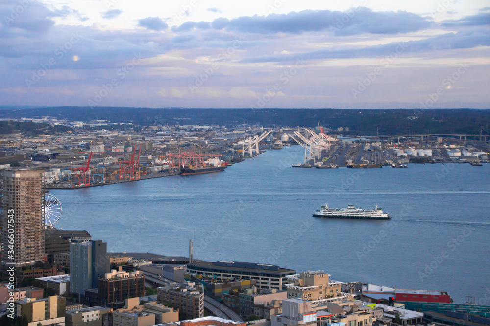 Arial view of Seattle from the Space Needle just before sunset with dark clouds moving in against a blue sky  Royalty free stock photo