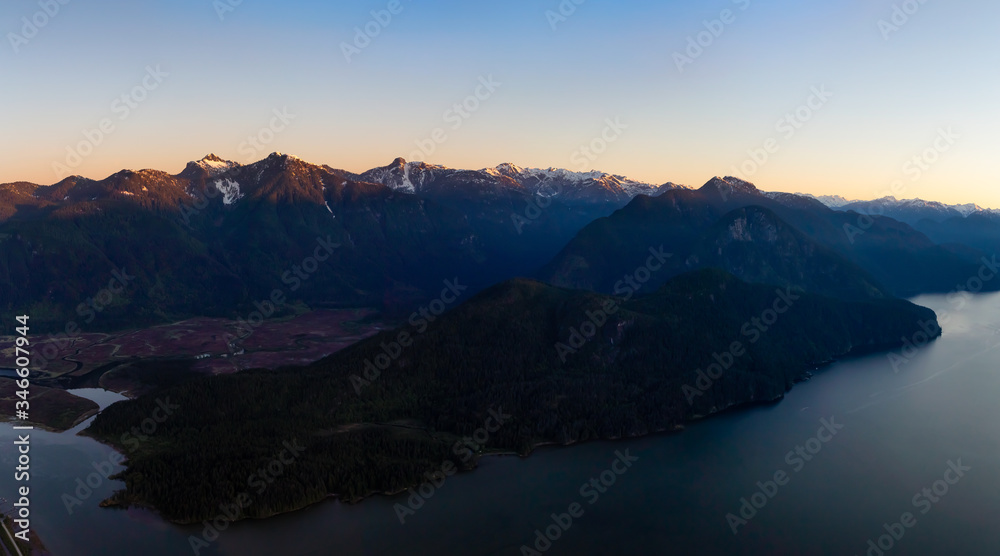 Aerial Panoramic View of Pitt Lake during s sunny sunrise. Located in Pitt Meadows, near Vancouver, British Columbia, Canada. Nature Panorama Background