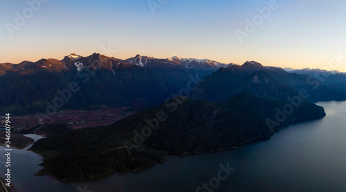 Aerial Panoramic View of Pitt Lake during s sunny sunrise. Located in Pitt Meadows  near Vancouver  British Columbia  Canada. Nature Panorama Background