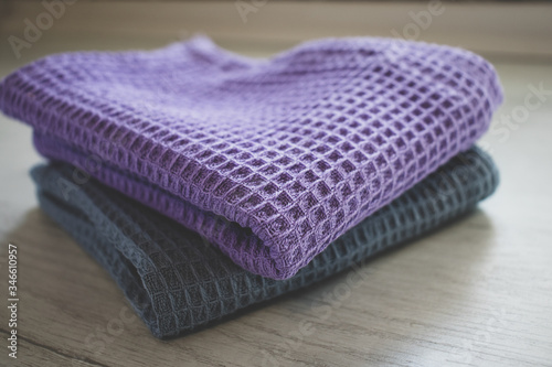 gray and purple checked kitchen towel, closeup, clean beautiful tablecloth