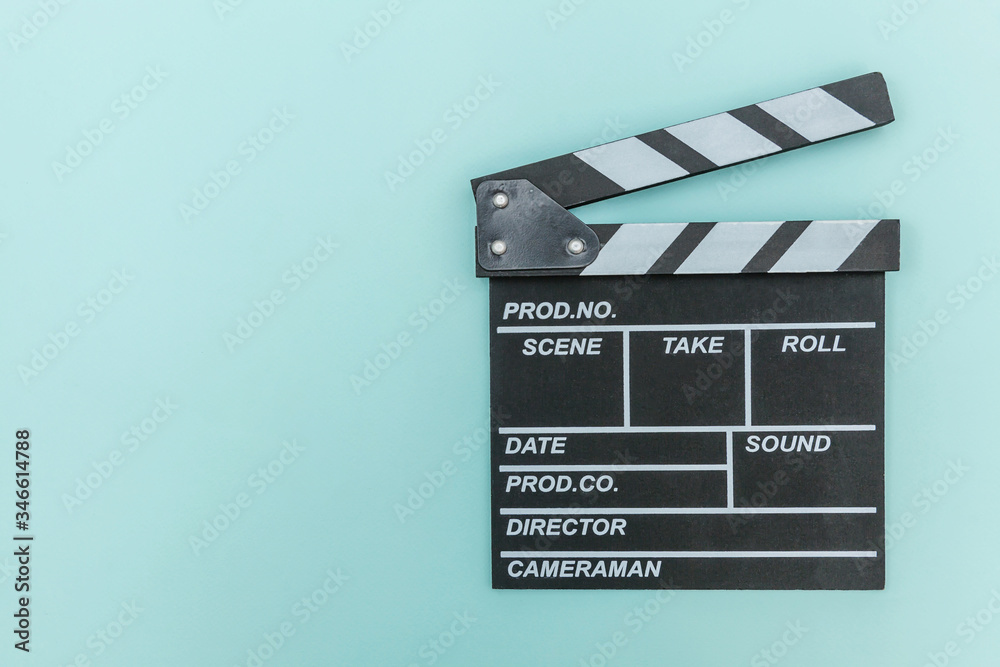 Filmmaker profession. Classic director empty film making clapperboard or movie slate isolated on blue background. Video production film cinema industry concept. Flat lay top view copy space mock up