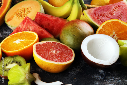 Tropical fruits background, many colorful ripe fresh tropical exotic fruits