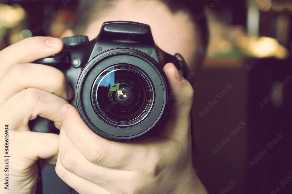 Young man holding a camera