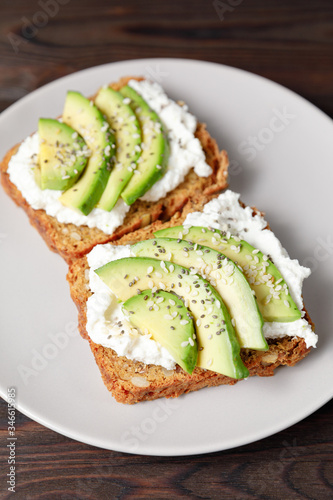 Variation of healthy toasts with avocado cream cheese and rye bread