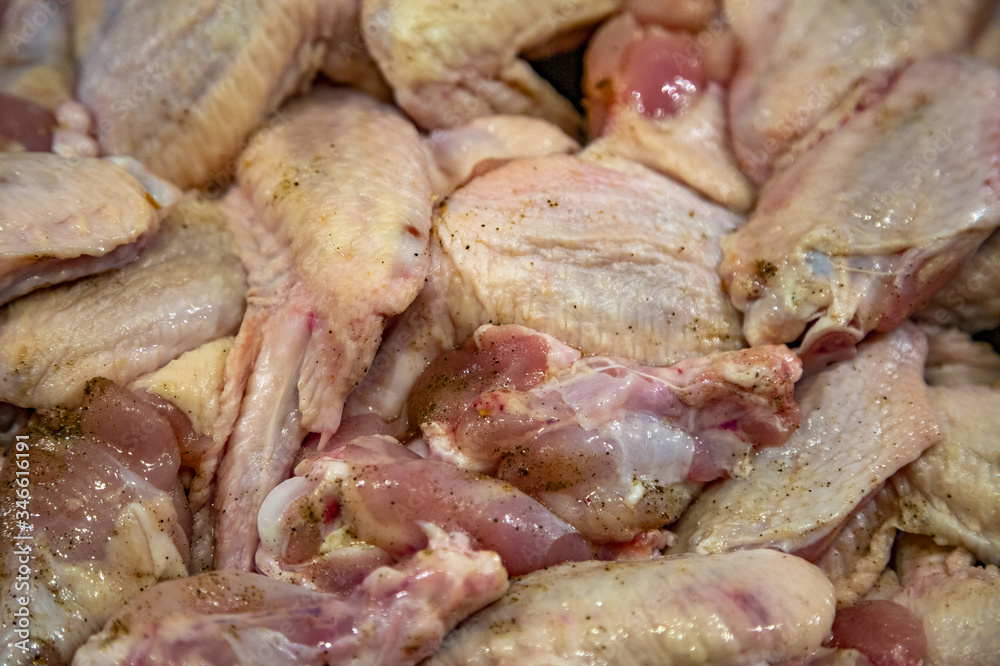 Fresh appetizing chicken wings fried on a kitchen gas stove Fresh appetizing chicken wings fried on a kitchen gas stove