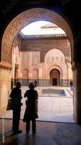 Silhouette of two tourists inbeautiful building in Marakesh , Morocco