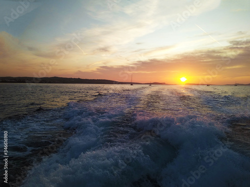 romantic sunset on the coast of the mediterranean sea in ibiza