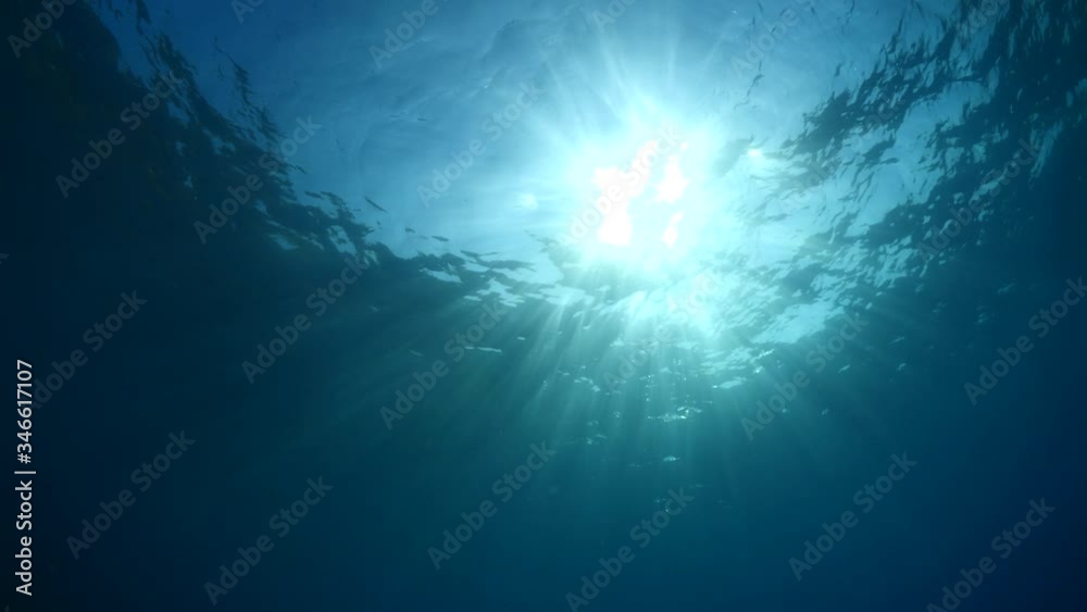 sun ray and sun beam scenery underwater waves on surface of water slow sun ray and sun beam scenery underwater waves on surface of water slow