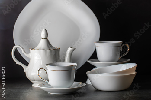 Wallpaper Mural White porcelain tea set-folded cups and saucers and teapot. Torontodigital.ca