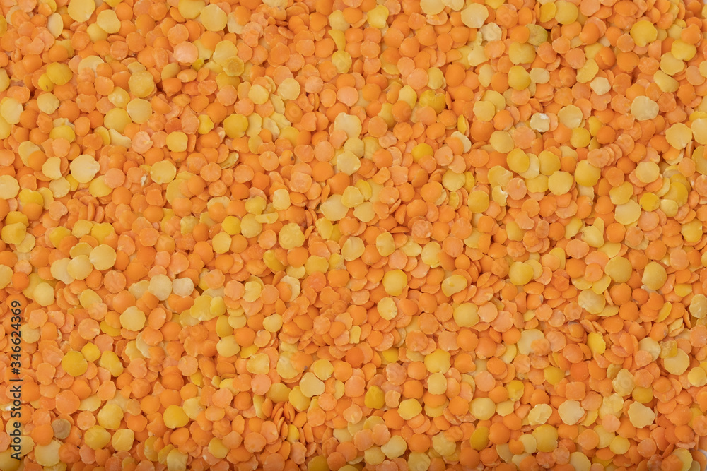Orange lentils on a white background