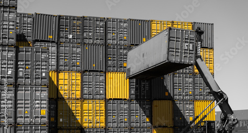 only yellow cargo containers in port